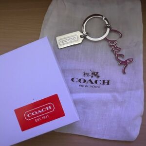 COACH KEYCHAIN PINK IN CURSIVE WRITING SILVER TONE w/cloth dust bag/box